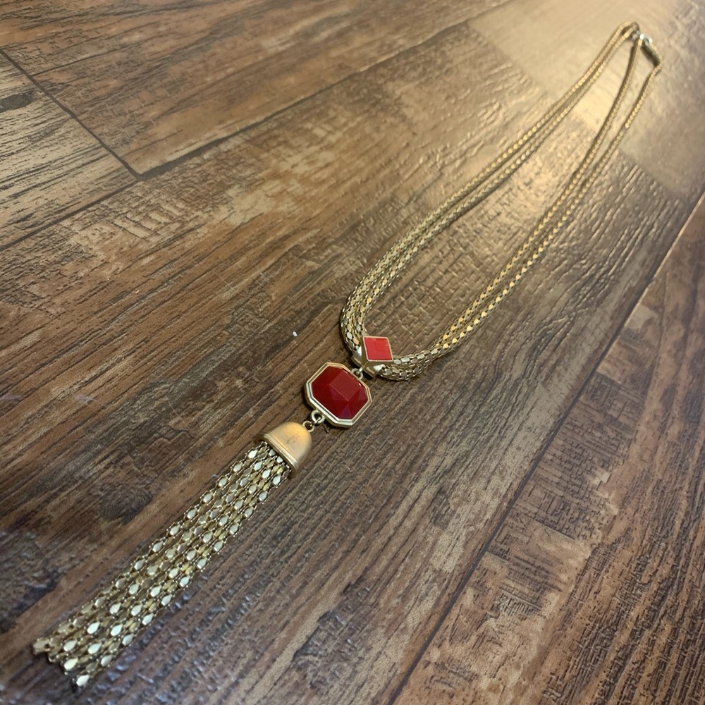 Long yellow gold necklace with red accents